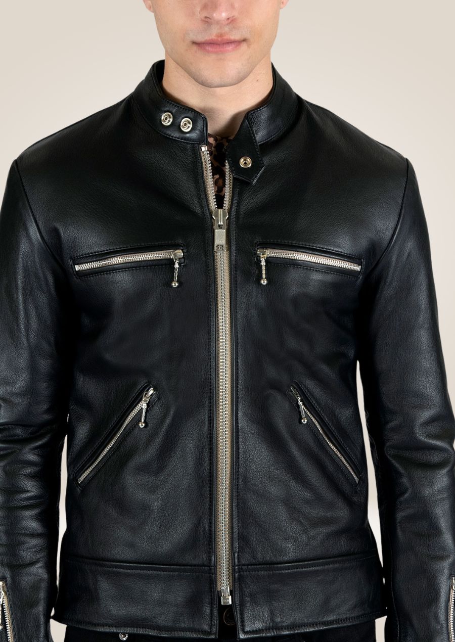 Men’s sleek black leather jacket with front zipper closure and zippered pockets, minimalist modern design.