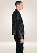 Men’s modern black leather jacket with asymmetrical zippered pockets and polished metal accents.